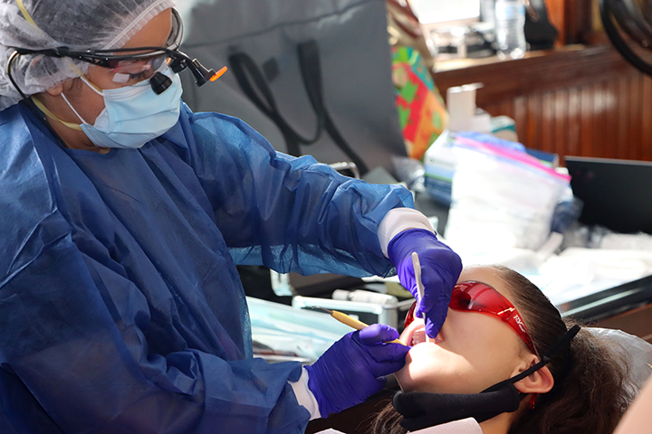 Dental provider working on young patient.